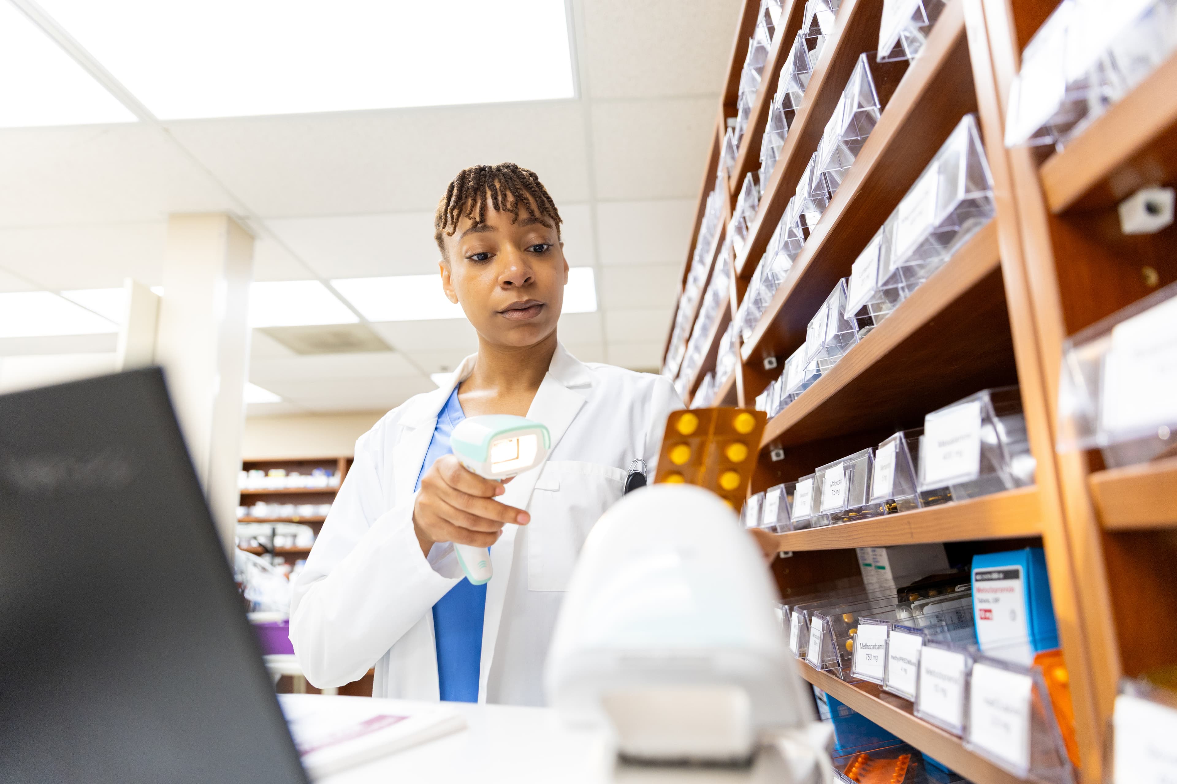 Researcher examining medicines safety data